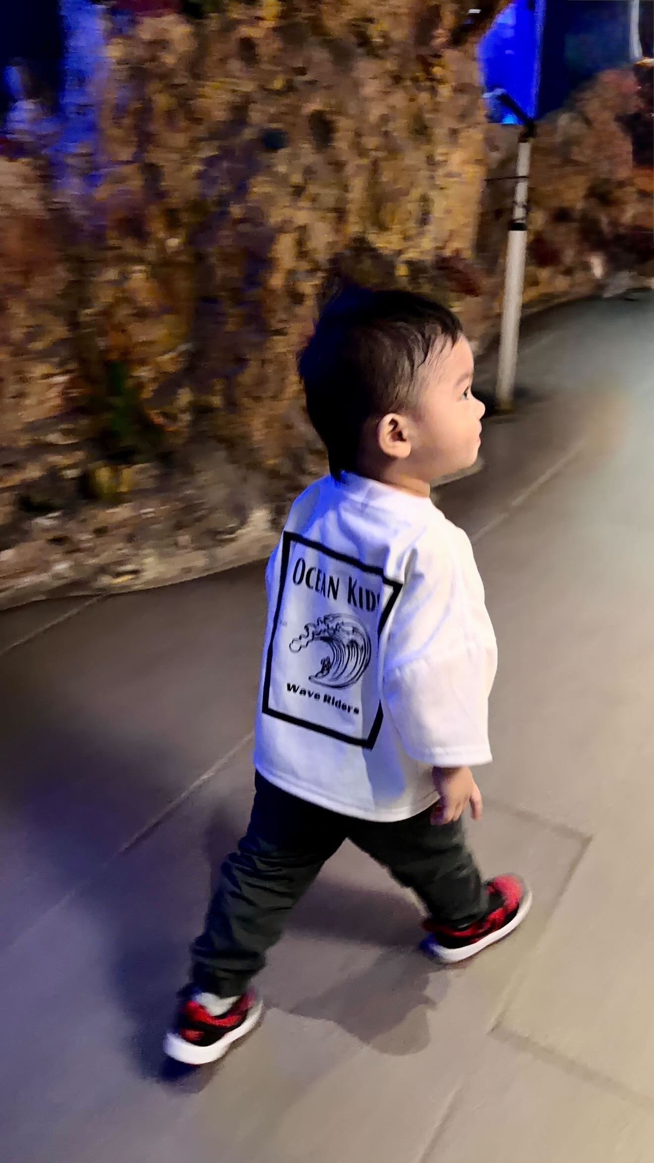 Child in Wave Riders Tee