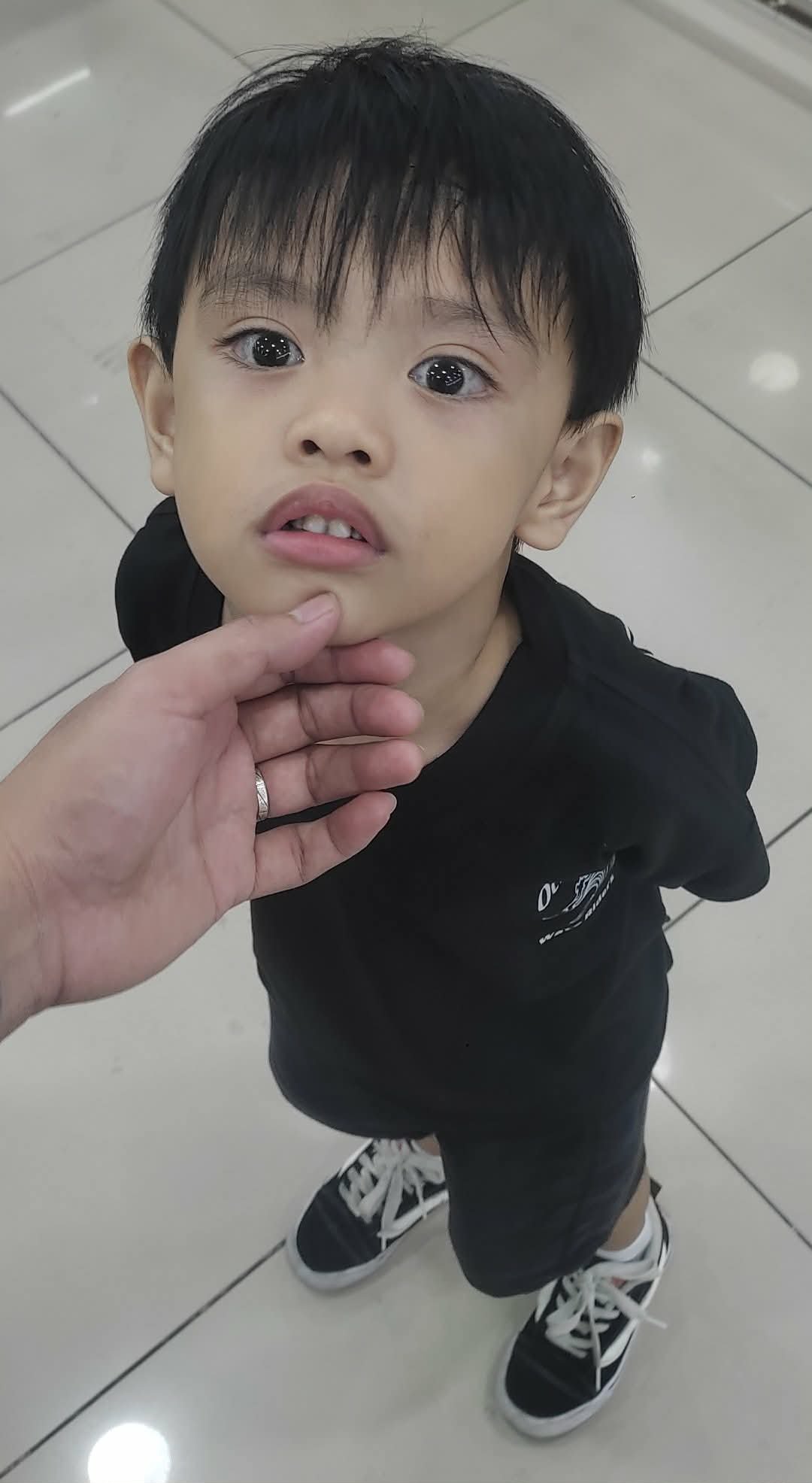 Child in Wave Riders Tee