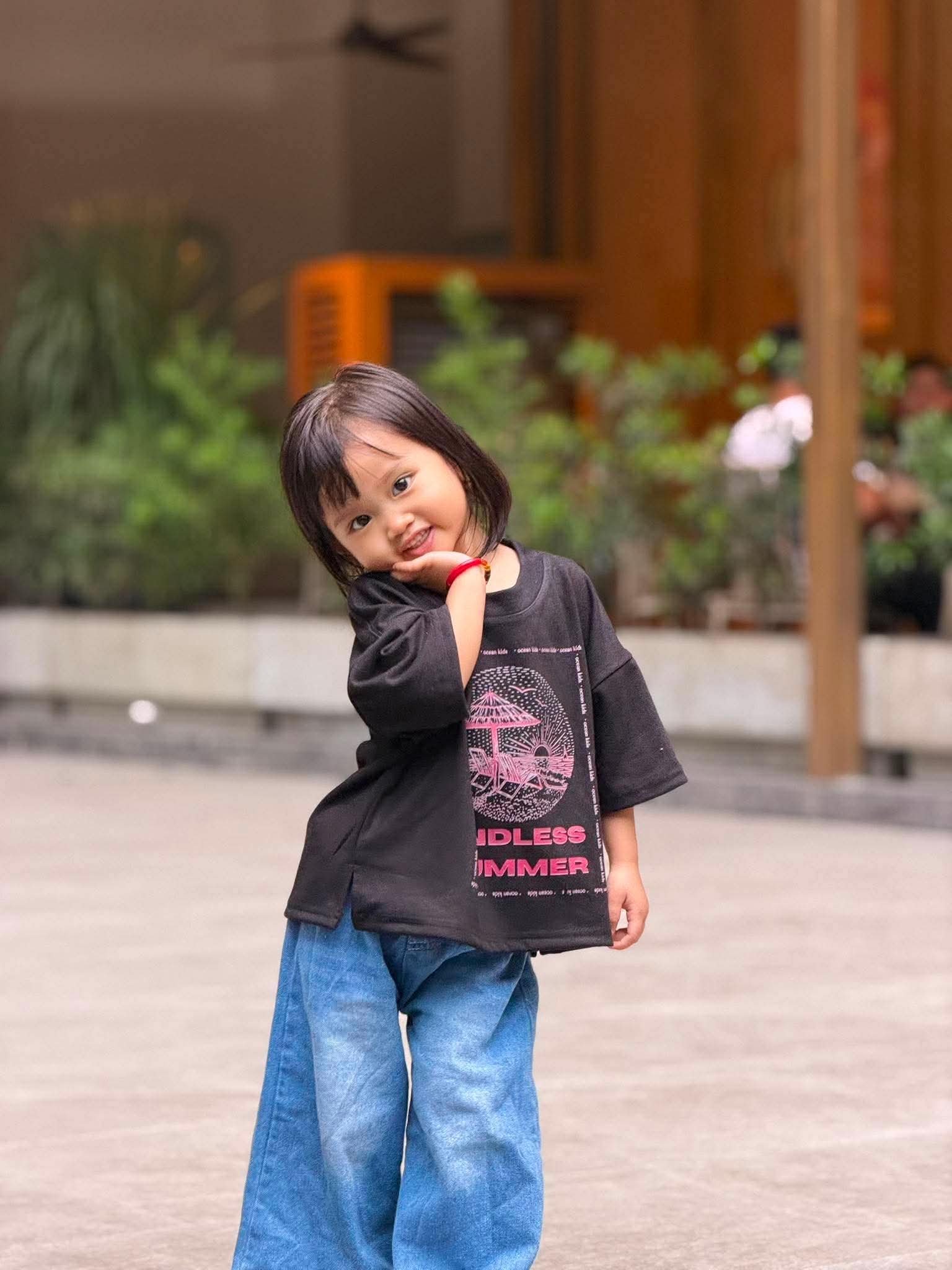 Ocean Kids model posing in Endless Summer Tee