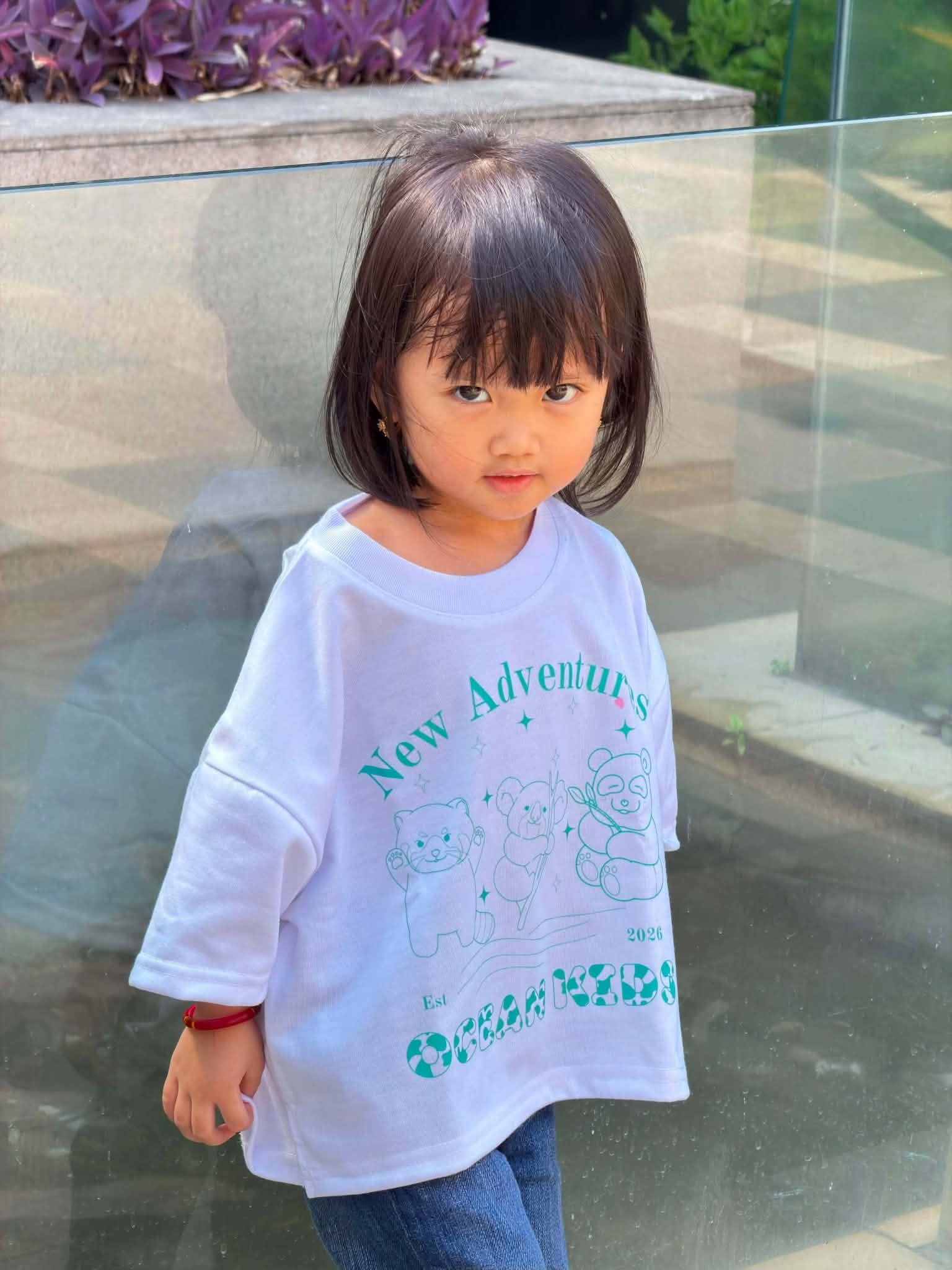 Ocean Kids model in New Adventures Tee