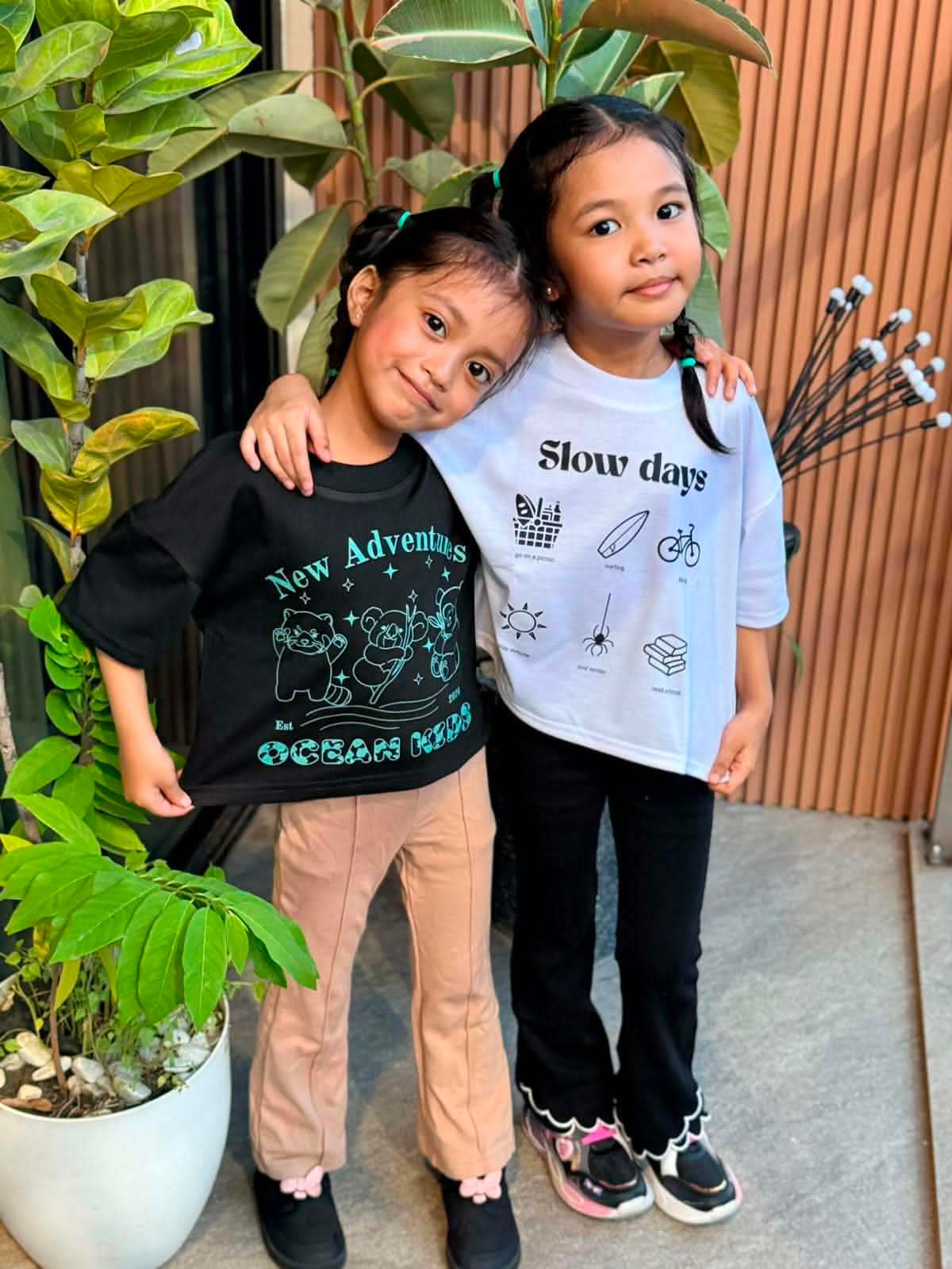 Two friends wearing Ocean Kids tees